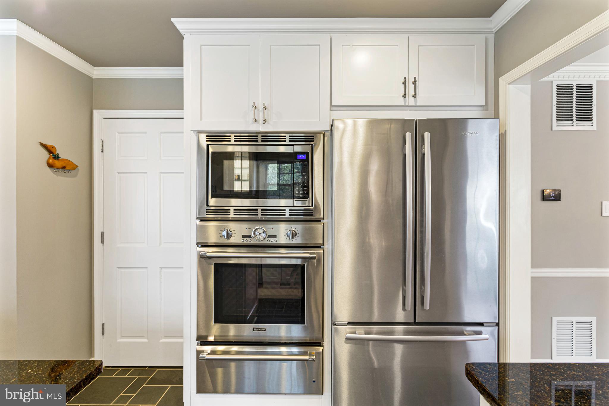 10904 Equestrian Court Reston, VA 20190 - Photo 22 of 81 a kitchen with stainless steel appliances granite countertop a refrigerator stove and sink