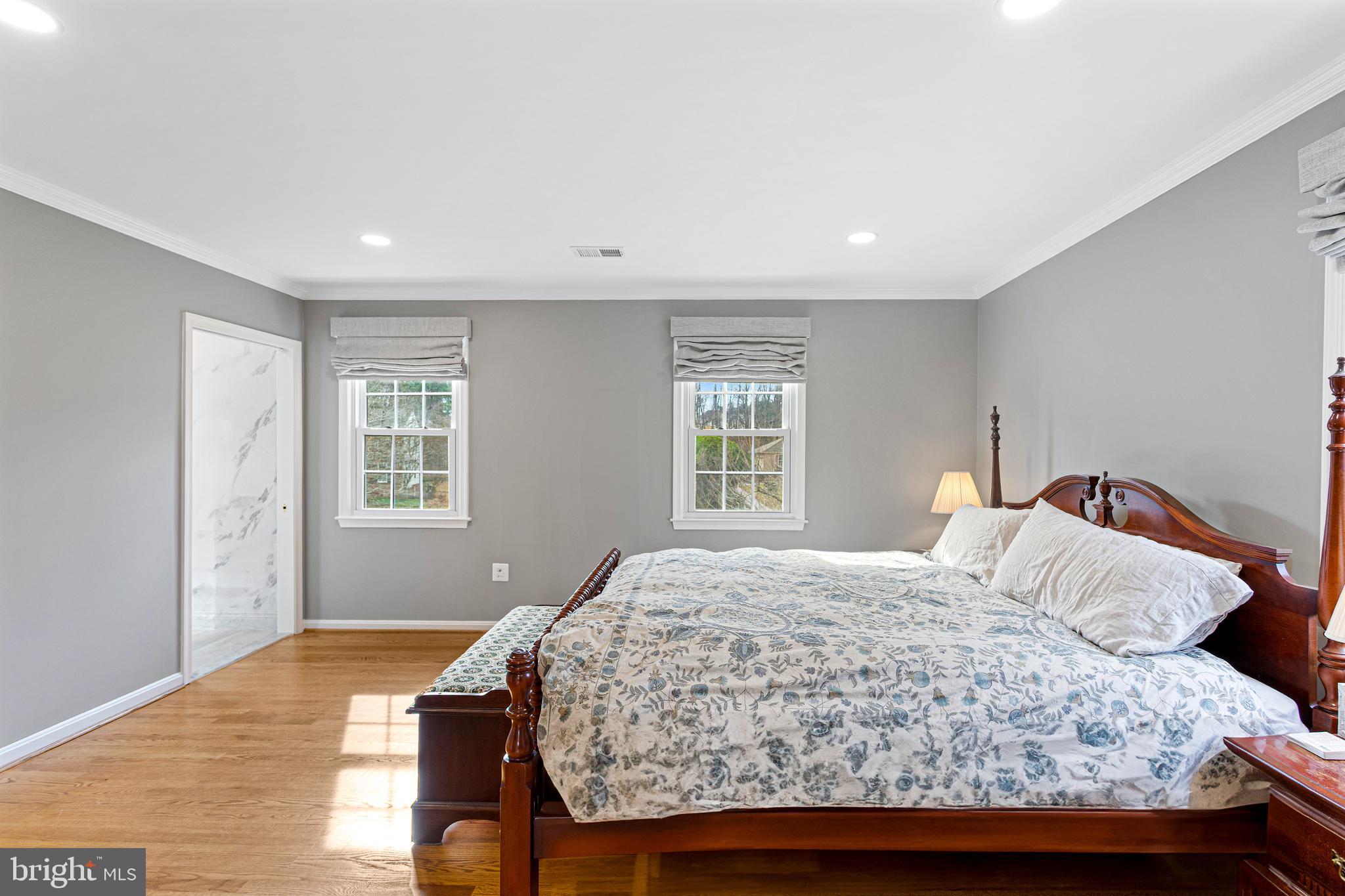 10904 Equestrian Court Reston, VA 20190 - Photo 33 of 81 a bedroom with a bed and wooden floor