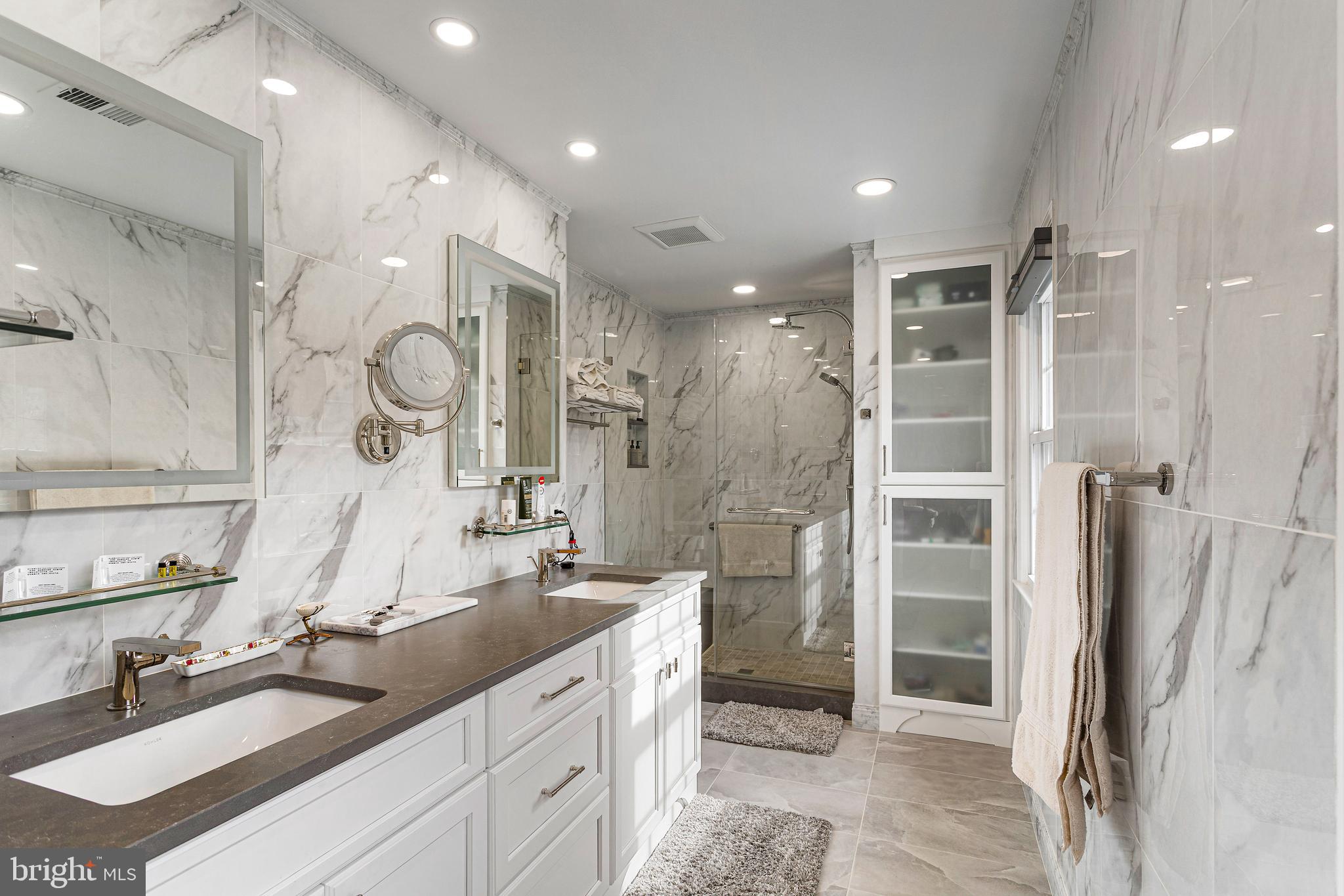 10904 Equestrian Court Reston, VA 20190 - Photo 34 of 81 a spacious bathroom with double vanity and a shower