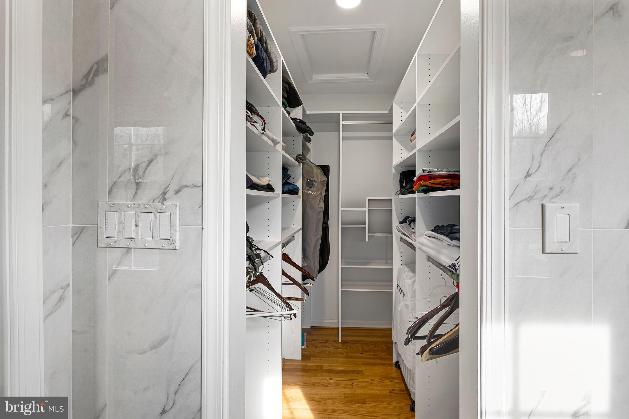 10904 Equestrian Court Reston, VA 20190 - Photo 36 of 81 a view of walk in closet with clothes and shoes