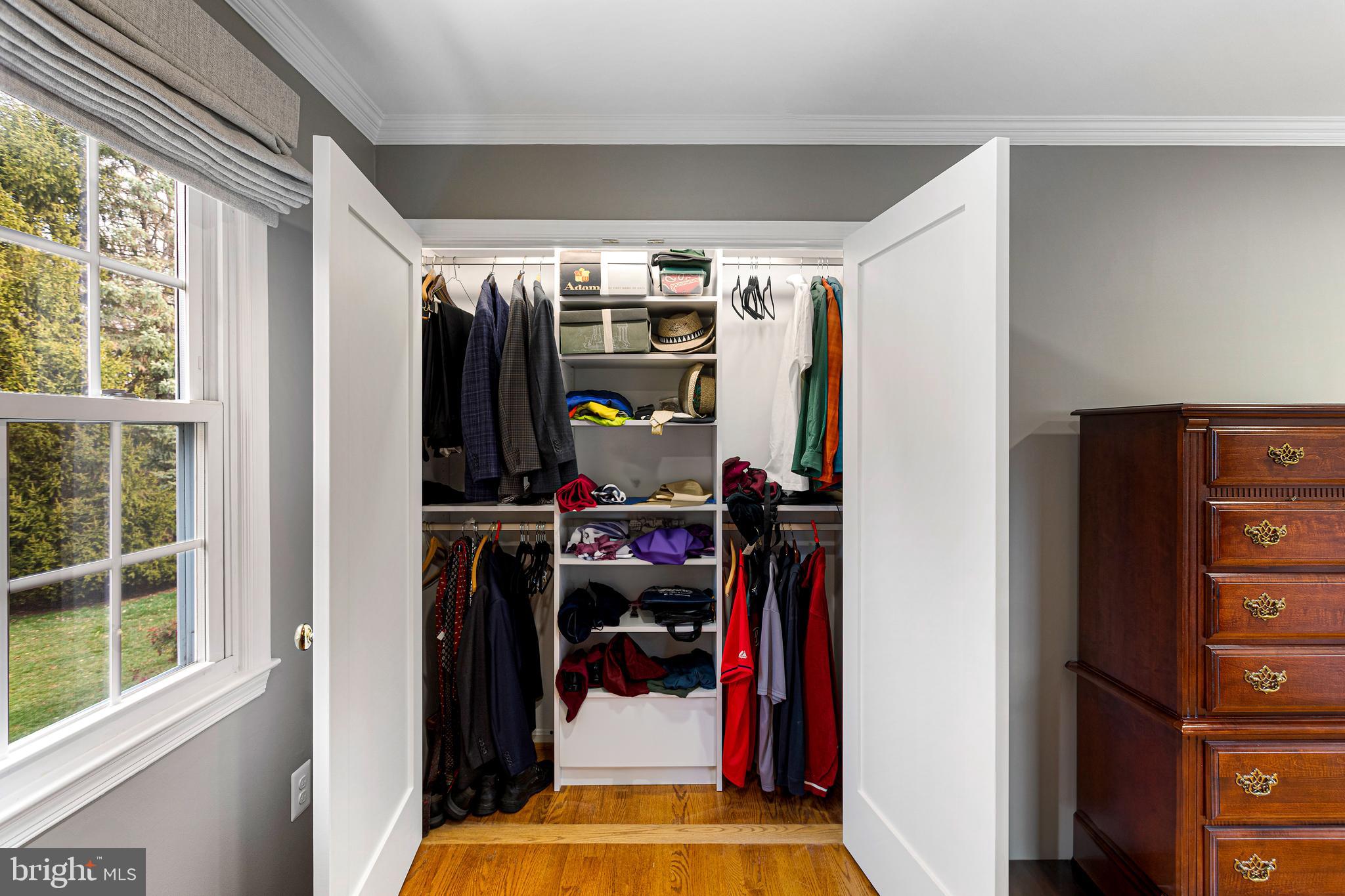 10904 Equestrian Court Reston, VA 20190 - Photo 40 of 81 a view of walk in closet with clothes and shoes