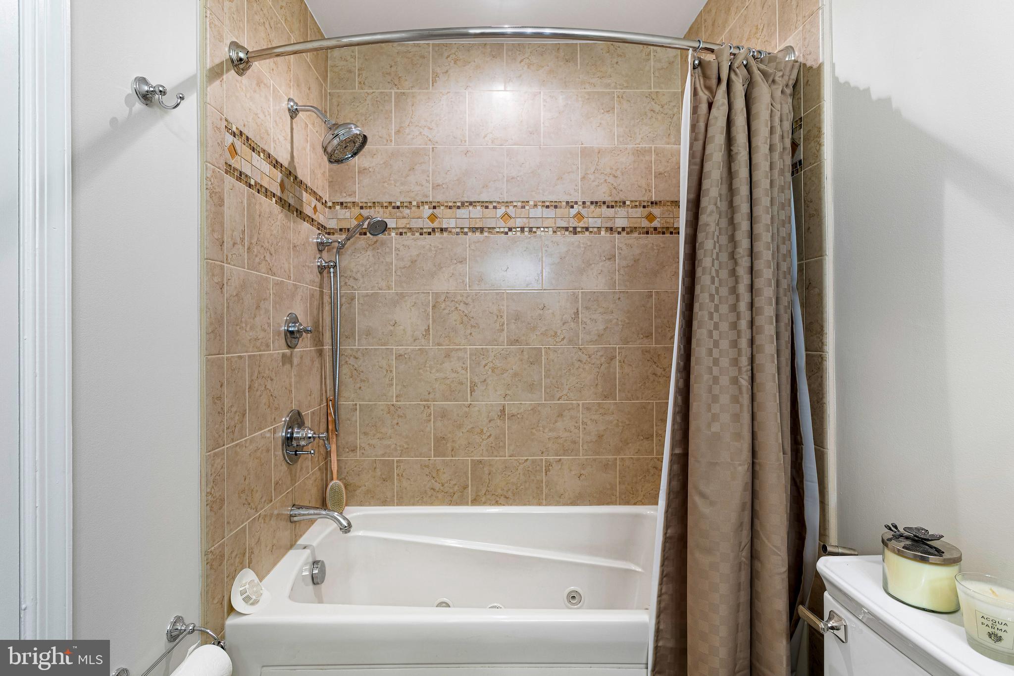 10904 Equestrian Court Reston, VA 20190 - Photo 47 of 81 a bathroom with a shower and a tub
