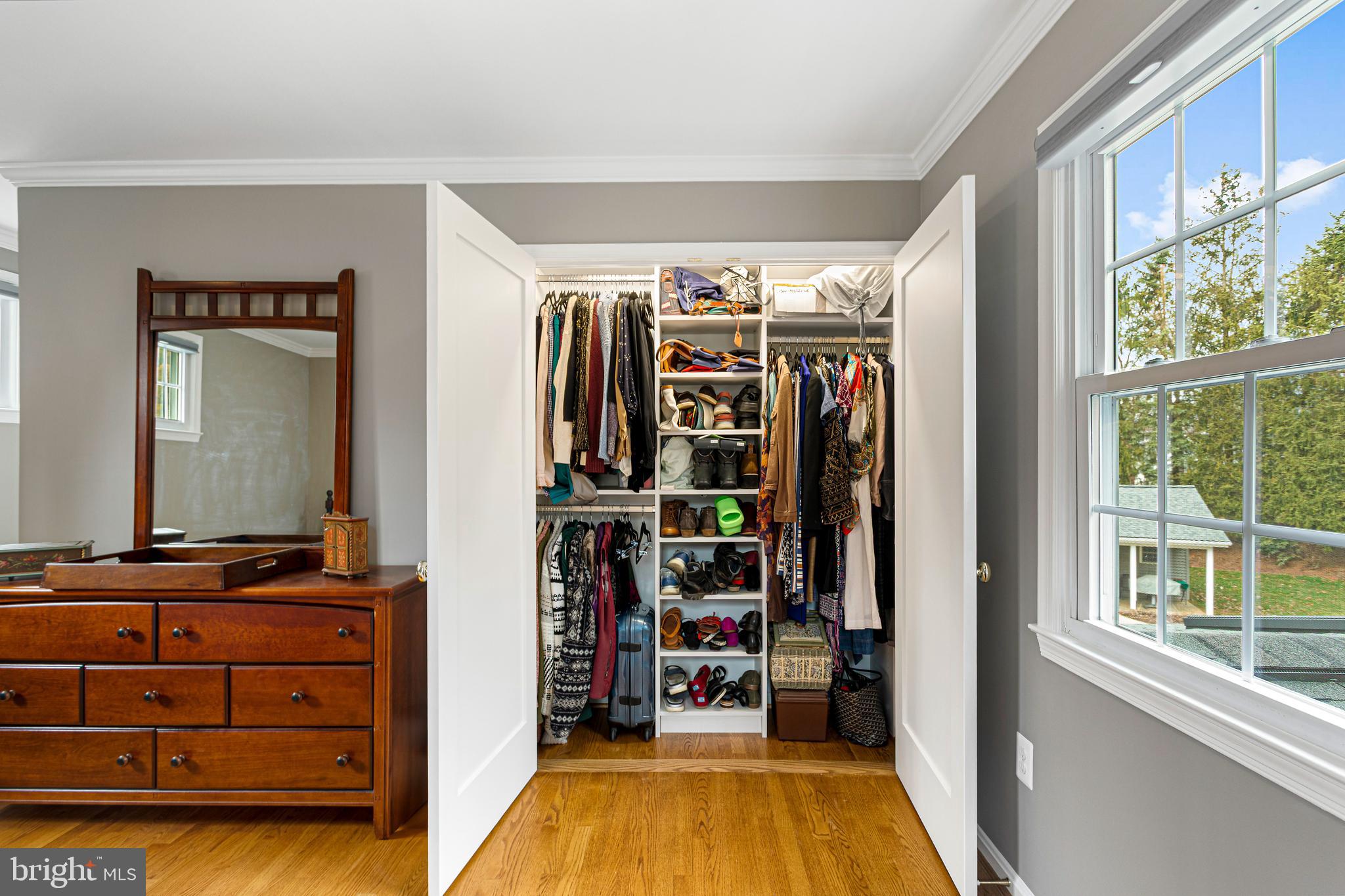 10904 Equestrian Court Reston, VA 20190 - Photo 50 of 81 a view of walk in closet with clothes and shoes