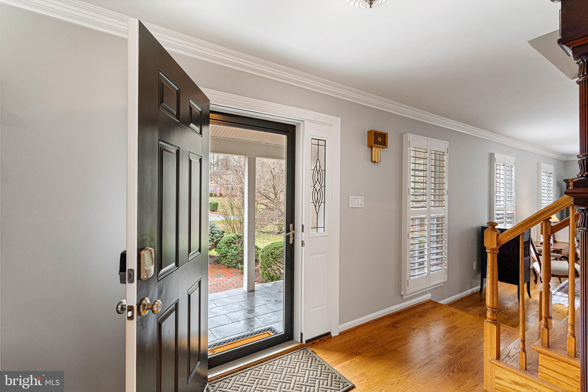10904 Equestrian Court Reston, VA 20190 - Photo 5 of 81 a view of an entryway with wooden floor and windows