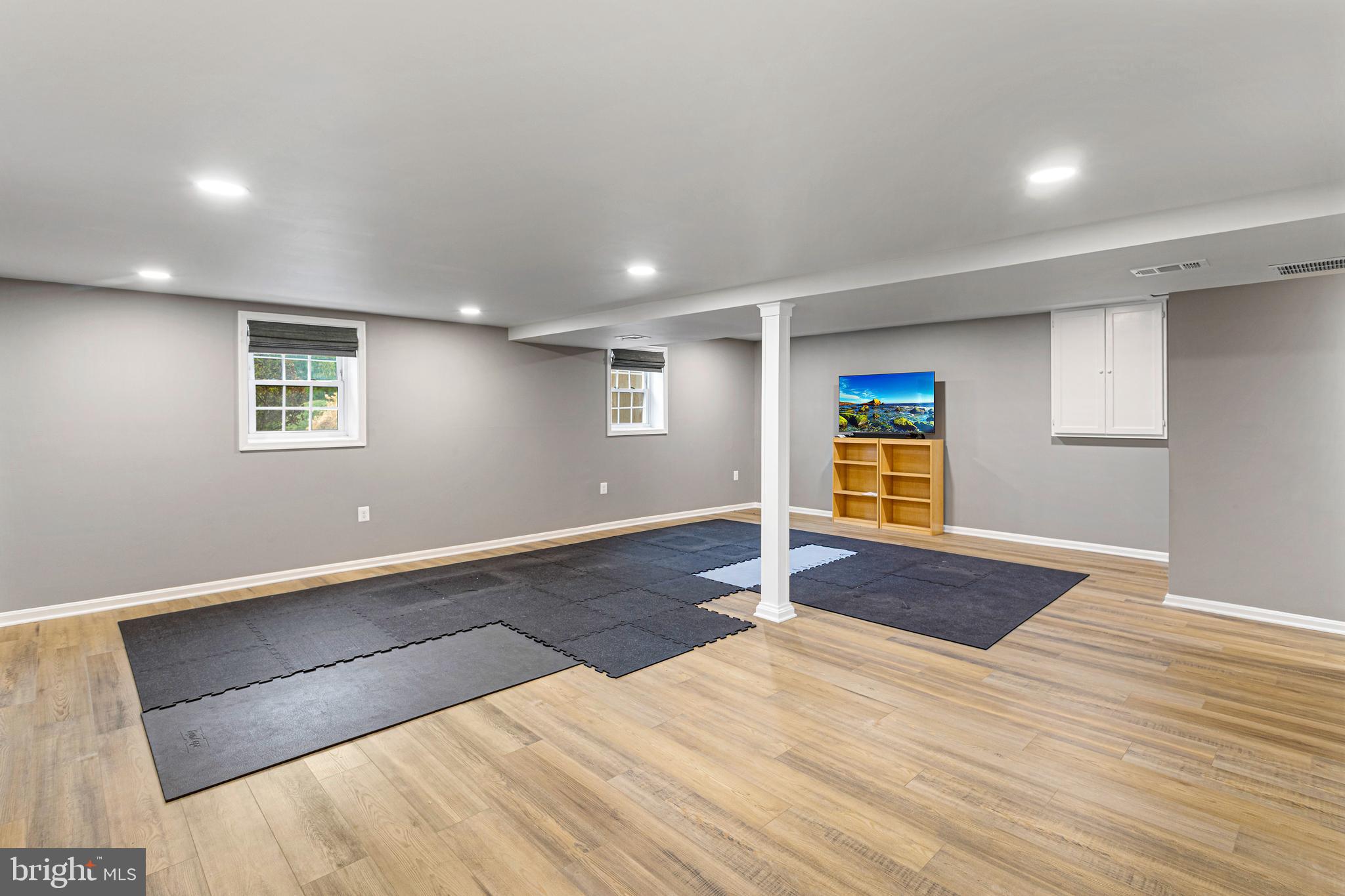 10904 Equestrian Court Reston, VA 20190 - Photo 52 of 81 an empty room with wooden floor and window
