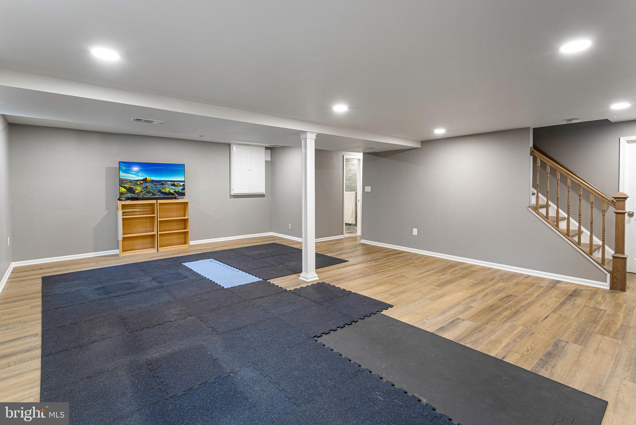 10904 Equestrian Court Reston, VA 20190 - Photo 54 of 81 a view of an empty room with wooden floor and stairs