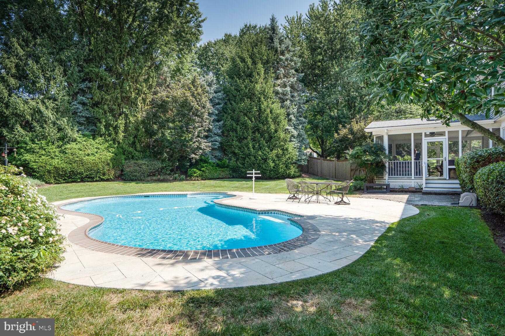 10904 Equestrian Court Reston, VA 20190 - Photo 62 of 81 a view of a house with swimming pool and a yard