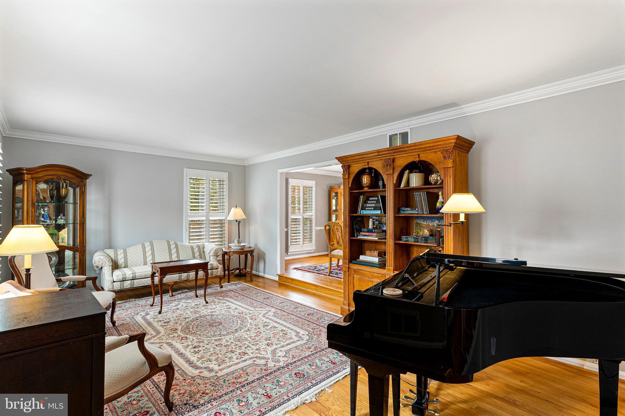 10904 Equestrian Court Reston, VA 20190 - Photo 7 of 81 a living room with furniture fireplace and a window
