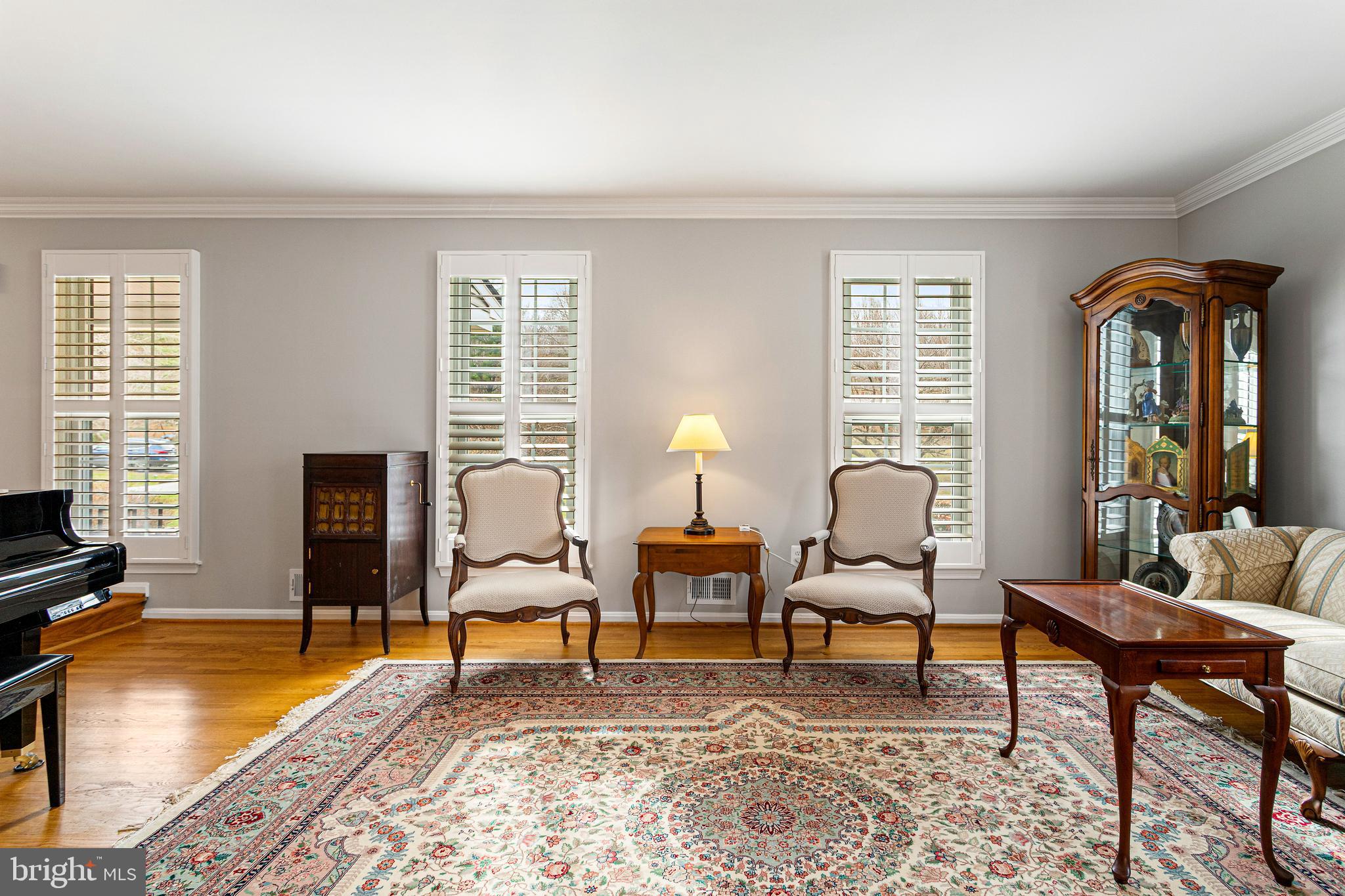 10904 Equestrian Court Reston, VA 20190 - Photo 10 of 81 a living room with furniture and a flat screen tv with wooden floor