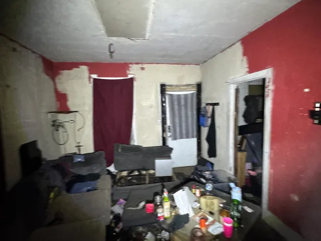 a room with furniture and gym equipment