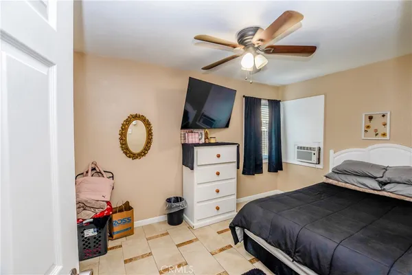 a bedroom with a bed and furniture