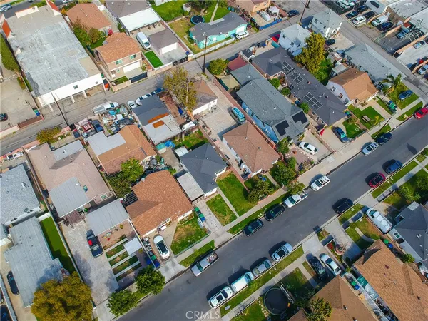 an aerial view of residential house with outdoor space and parking