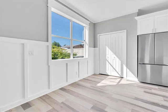 a kitchen with a refrigerator a stove top oven a sink and dishwasher