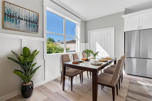 a bed room with a bed a couch and a potted plant