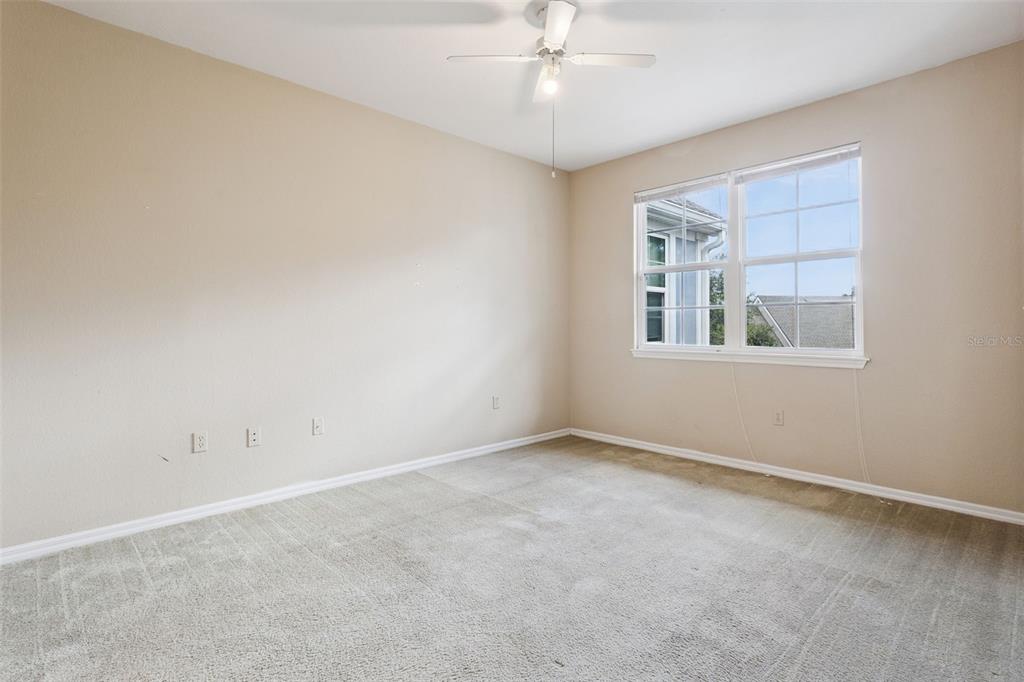 3446 Soho Street, Unit 303 Orlando, FL 32835 - Photo 20 of 47 a view of an empty room with a window
