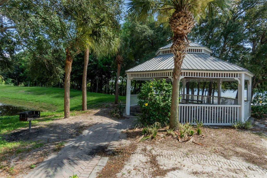 3446 Soho Street, Unit 303 Orlando, FL 32835 - Photo 26 of 47 a front view of a house with garden