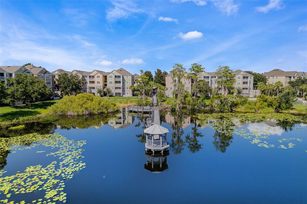 3446 Soho Street, Unit 303 Orlando, FL 32835 - Photo 29 of 47 a view of a lake with a city
