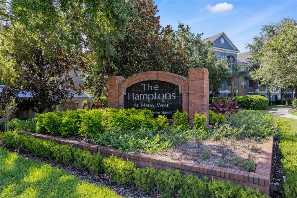 3446 Soho Street, Unit 303 Orlando, FL 32835 - Photo 5 of 47 a front view of a house with garden