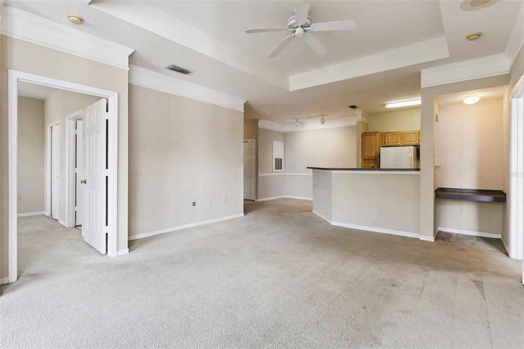 3446 Soho Street, Unit 303 Orlando, FL 32835 - Photo 8 of 47 a view of a kitchen with a refrigerator and a sink