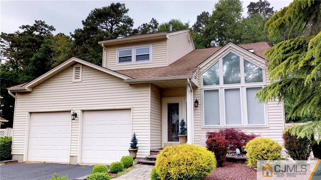 16 Sweet Gum Road Howell, NJ 07731 - Photo 1 of 21 a view of a house with a yard and potted plants