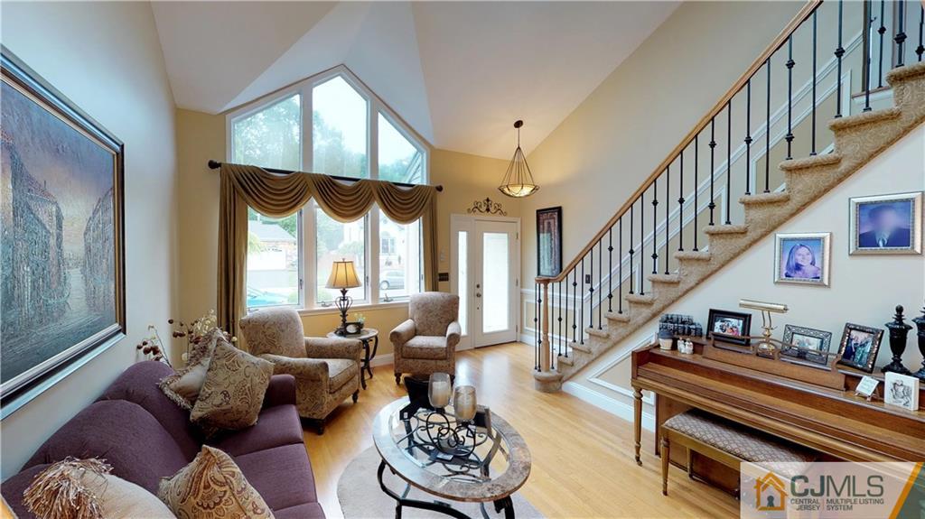 16 Sweet Gum Road Howell, NJ 07731 - Photo 2 of 21 a living room with furniture fireplace and a large window