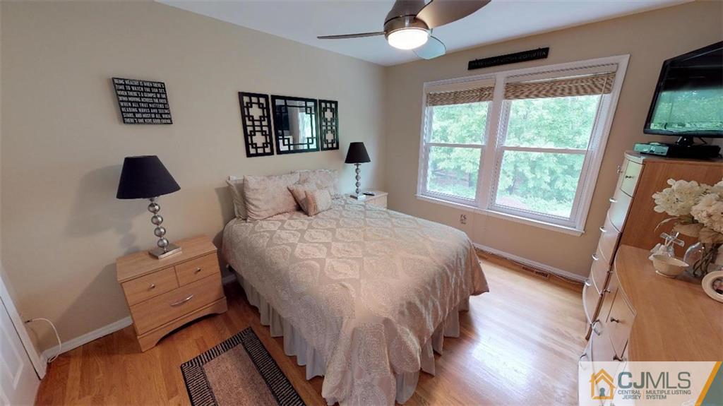 16 Sweet Gum Road Howell, NJ 07731 - Photo 11 of 21 a bedroom with a bed and a large window