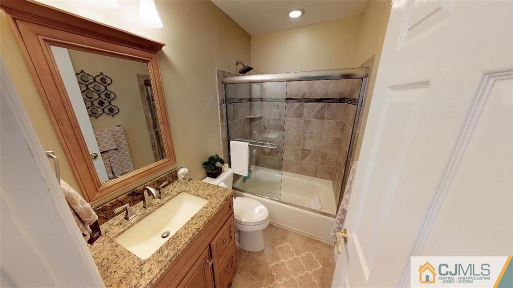 16 Sweet Gum Road Howell, NJ 07731 - Photo 12 of 21 a bathroom with a granite countertop sink toilet and shower