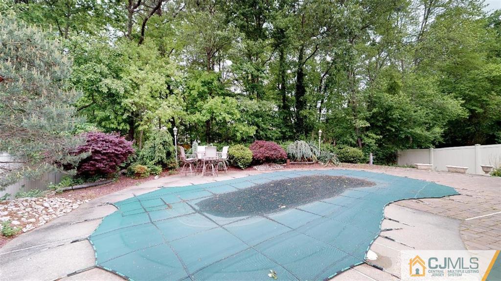 16 Sweet Gum Road Howell, NJ 07731 - Photo 18 of 21 a view of a backyard with a sitting area