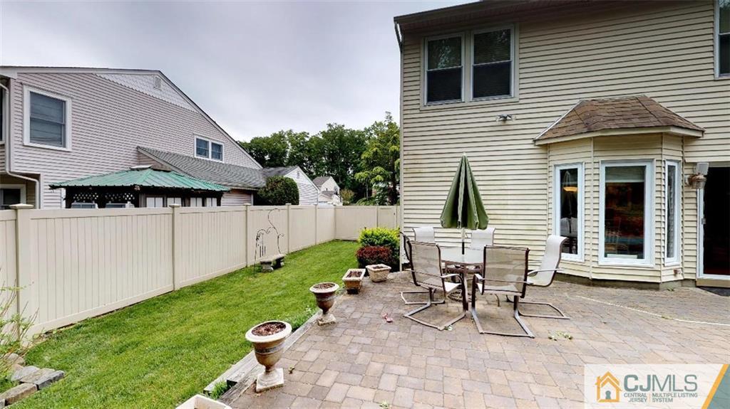 16 Sweet Gum Road Howell, NJ 07731 - Photo 19 of 21 a view of a house with backyard and sitting area