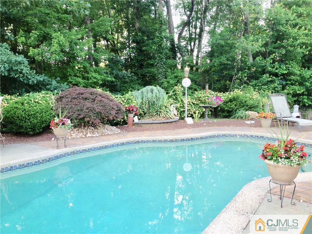 16 Sweet Gum Road Howell, NJ 07731 - Photo 20 of 21 a view of a garden with plants