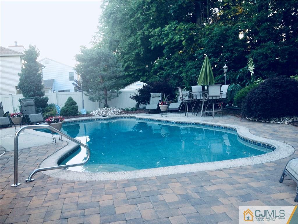 16 Sweet Gum Road Howell, NJ 07731 - Photo 21 of 21 a view of a swimming pool with a patio