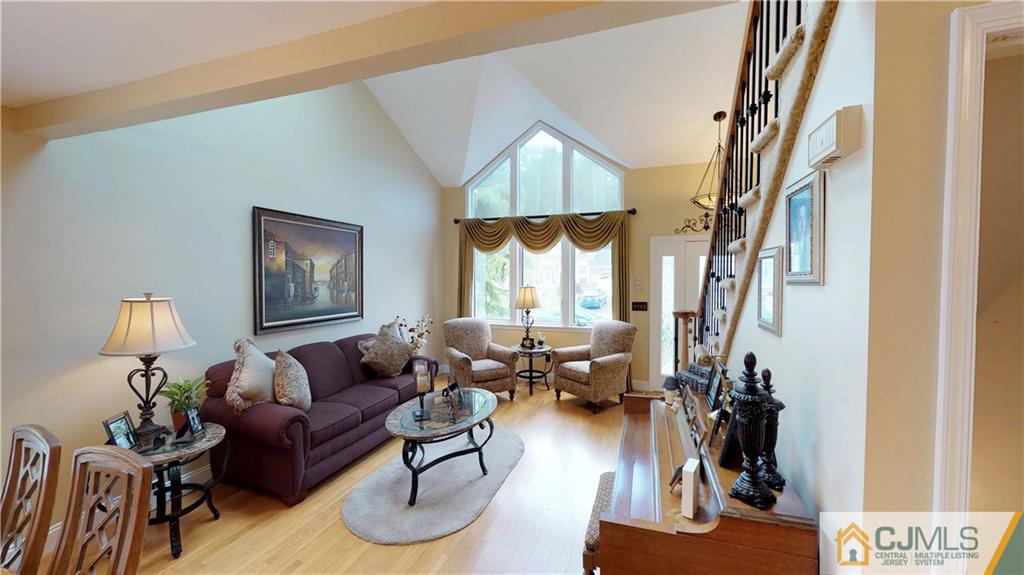 16 Sweet Gum Road Howell, NJ 07731 - Photo 4 of 21 a living room with furniture or couch and a potted plant