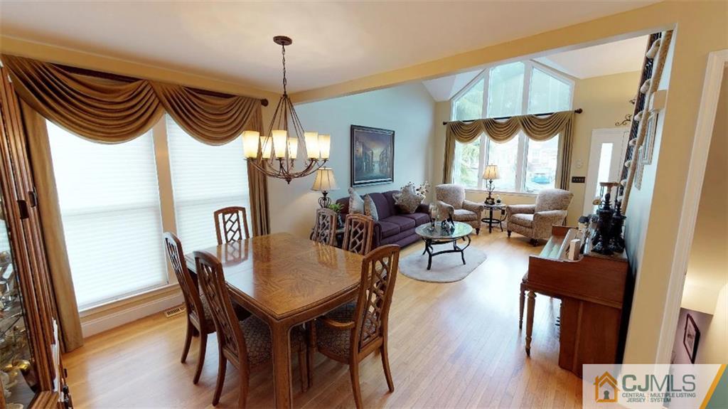 16 Sweet Gum Road Howell, NJ 07731 - Photo 5 of 21 a view of a dining room with furniture window and wooden floor