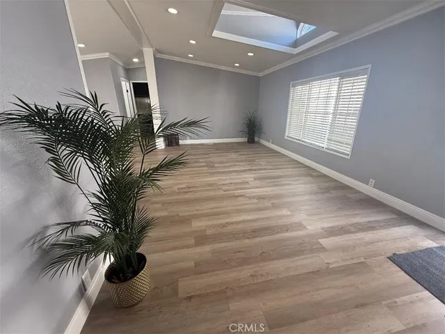 a view of entryway and hall with a potted plant