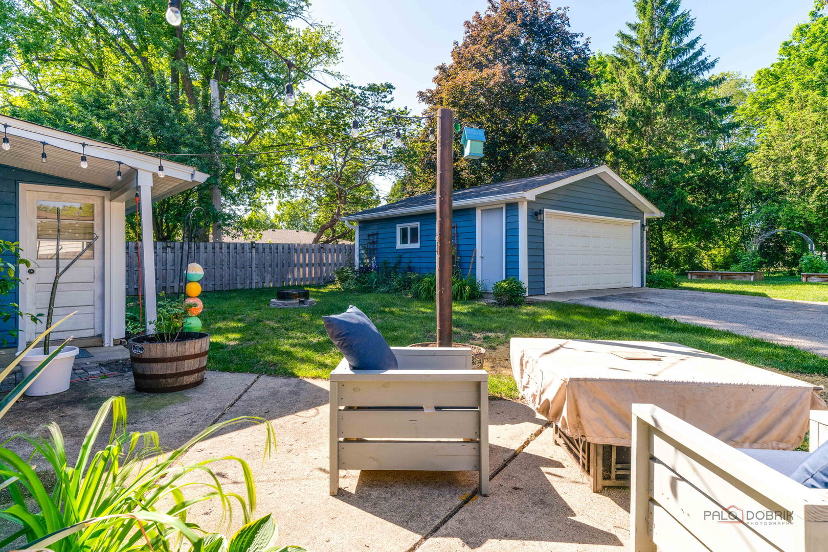 489 1st Street Antioch, IL 60002 - Photo 29 of 33 a view of a house with backyard sitting area and garden