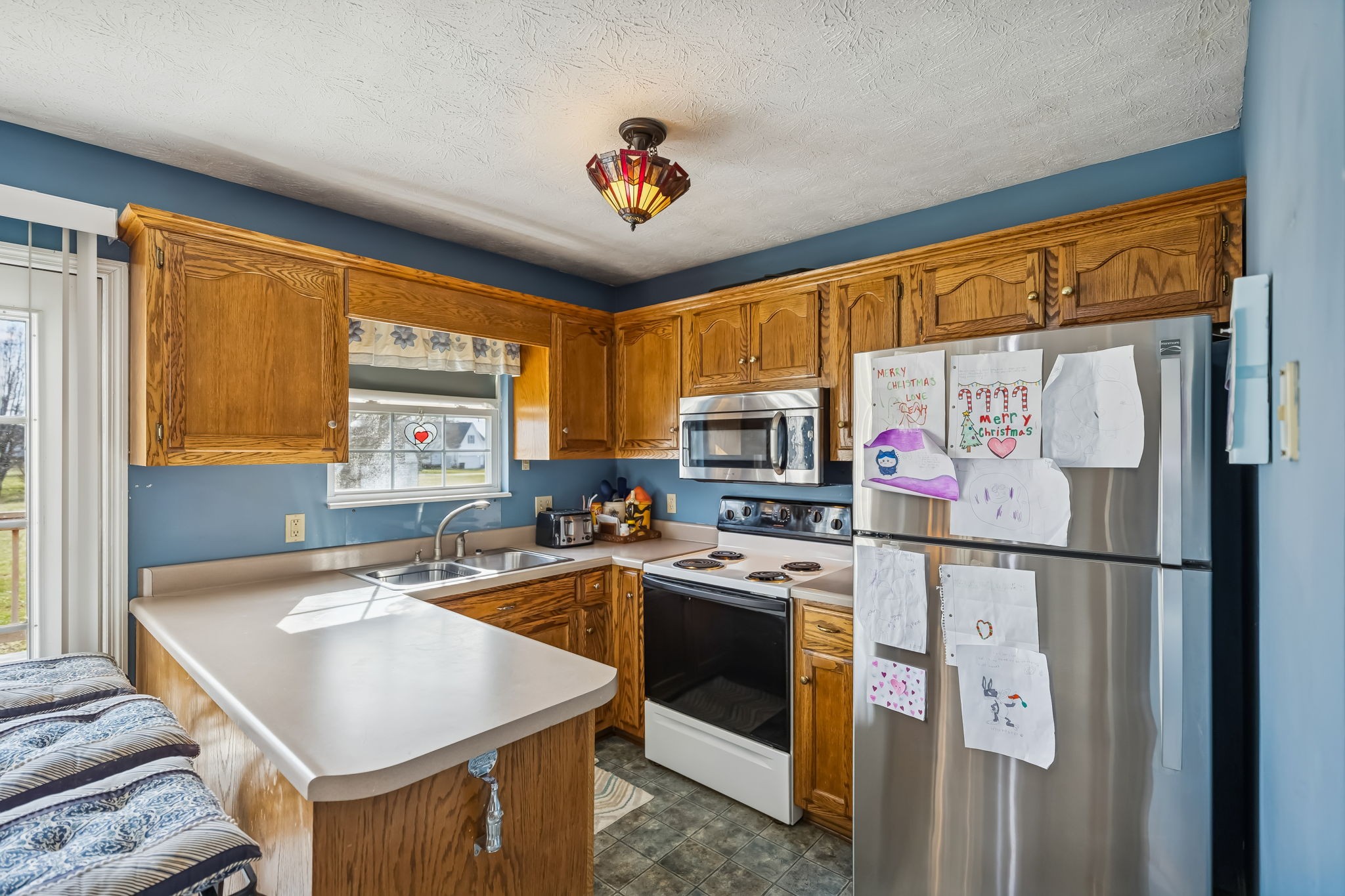 111 Eldon Drive Manchester, TN 37355 - Photo 11 of 24 a kitchen with stainless steel appliances granite countertop a sink stove and refrigerator