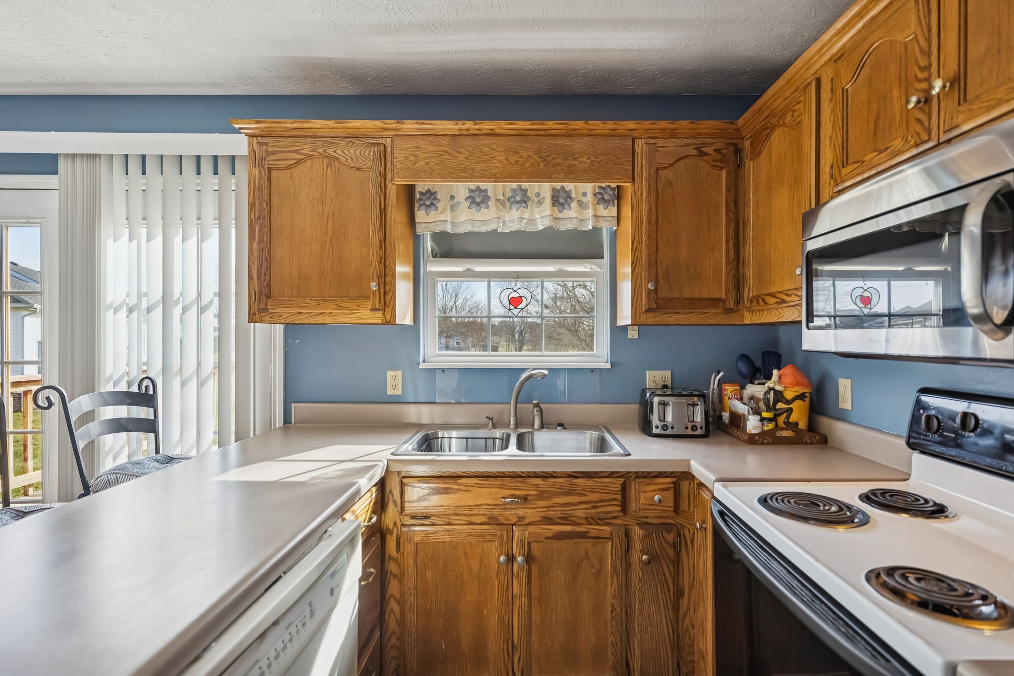 111 Eldon Drive Manchester, TN 37355 - Photo 12 of 24 a kitchen with stainless steel appliances a sink a stove and a refrigerator