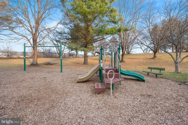 a backyard of a house with barbeque oven