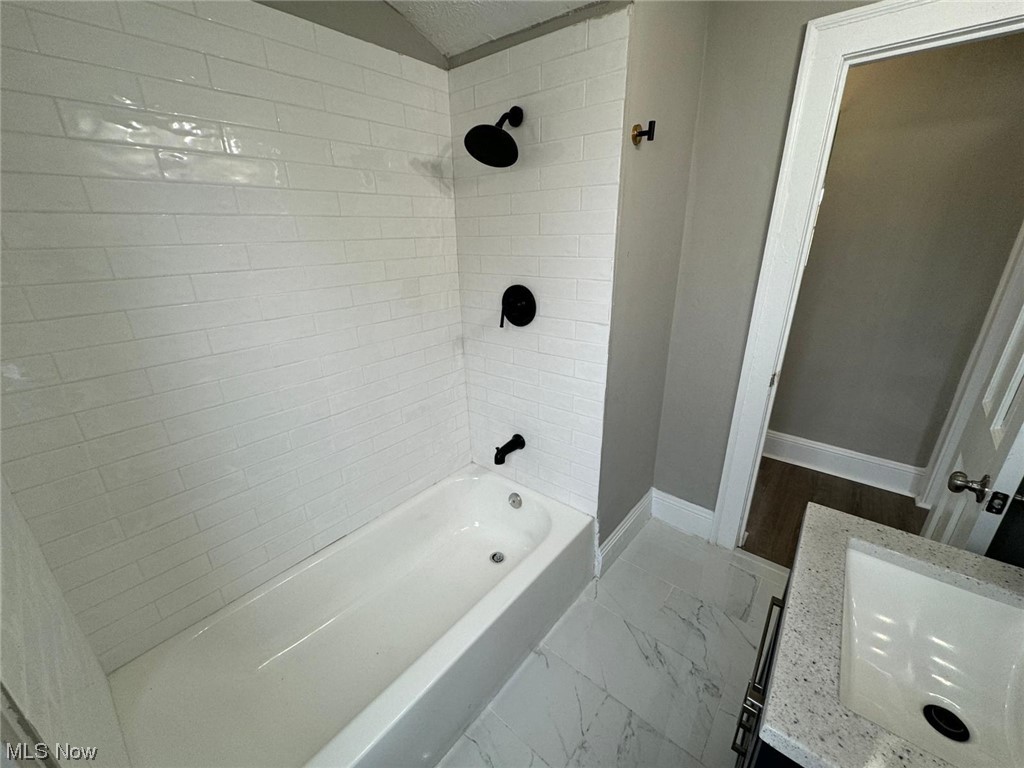 3333 Berea Road Cleveland, OH 44111 - Photo 29 of 34 Bathroom with wood-type flooring, vanity, and tiled shower / bath combo