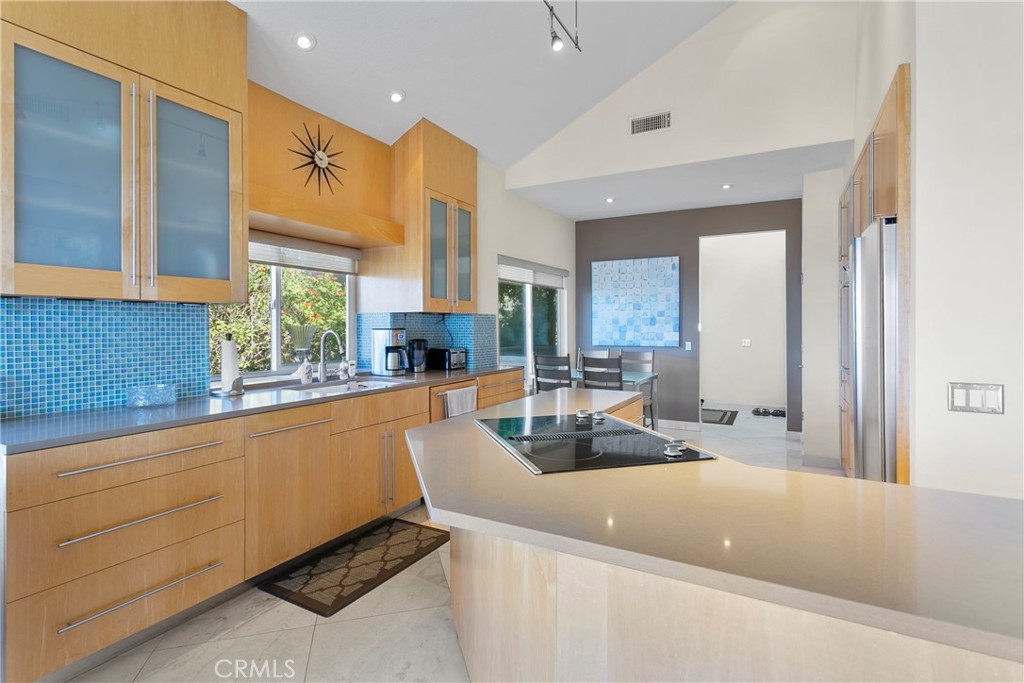 25 St Raphael Laguna Niguel, CA 92677 - Photo 12 of 23 a kitchen with a sink a counter top space and living room area