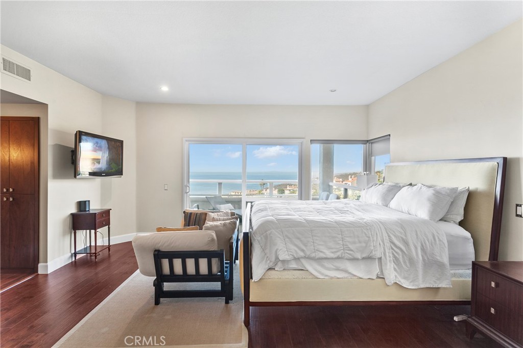 25 St Raphael Laguna Niguel, CA 92677 - Photo 16 of 23 a bedroom with a bed and a couch