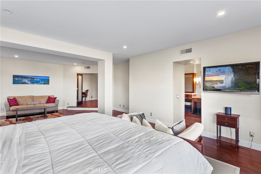 25 St Raphael Laguna Niguel, CA 92677 - Photo 17 of 23 a bedroom with a bed and wooden floor