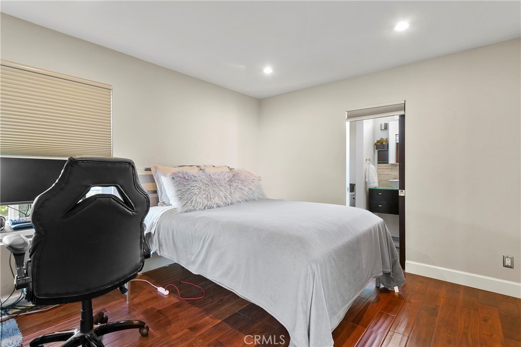 25 St Raphael Laguna Niguel, CA 92677 - Photo 20 of 23 a bedroom with a bed and a chair