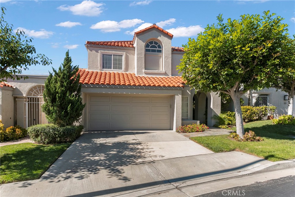25 St Raphael Laguna Niguel, CA 92677 - Photo 22 of 23 a front view of a house with yard and garage