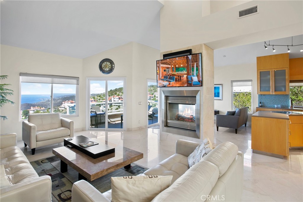 25 St Raphael Laguna Niguel, CA 92677 - Photo 7 of 23 a living room with furniture and a fireplace