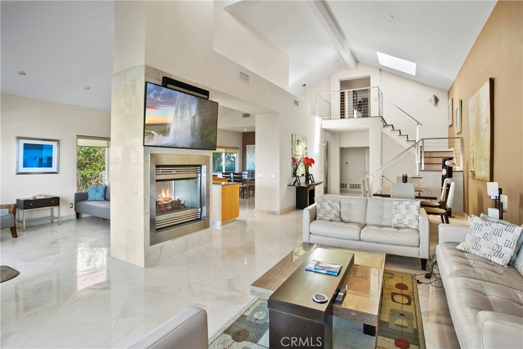 25 St Raphael Laguna Niguel, CA 92677 - Photo 8 of 23 a living room with furniture and a fireplace