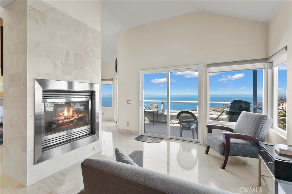 25 St Raphael Laguna Niguel, CA 92677 - Photo 10 of 23 a living room with furniture and a fireplace