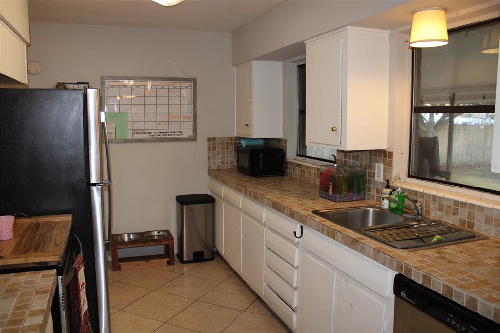 11364 79th Avenue Seminole, FL 33772 - Photo 11 of 28 a bathroom with a sink double vanity and a mirror