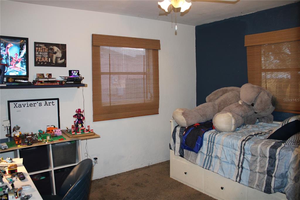 11364 79th Avenue Seminole, FL 33772 - Photo 16 of 28 a bedroom with a bed and a window