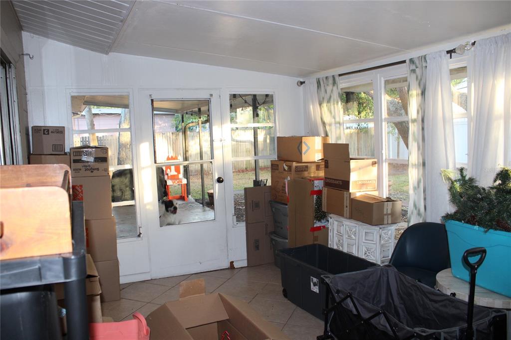 11364 79th Avenue Seminole, FL 33772 - Photo 21 of 28 a living room with furniture and a window